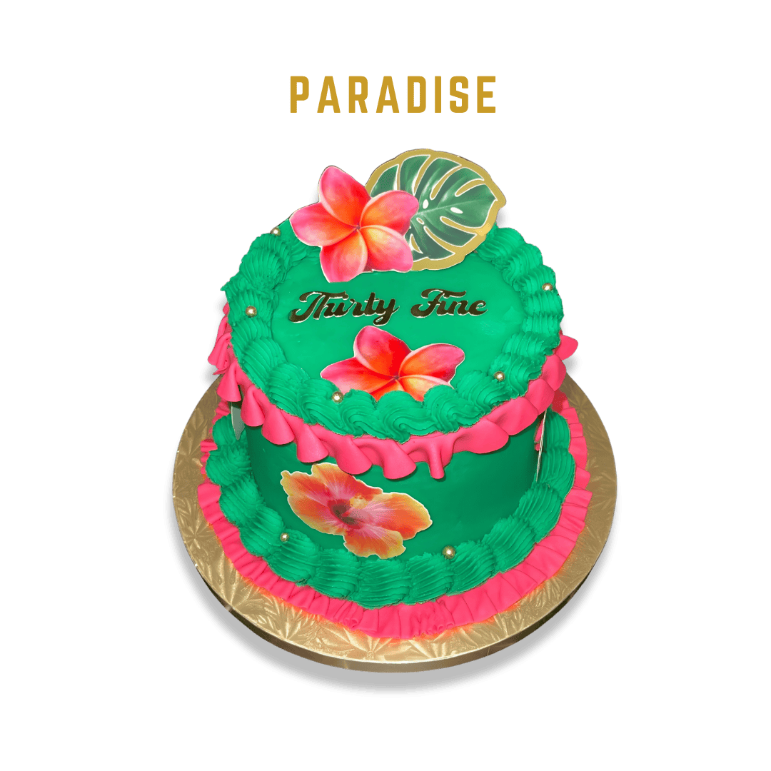Colorful two-tiered birthday cake with green and pink frosting, decorated with pink and orange hibiscus flowers, a Monstera leaf, and the words 'Thirty Fine' on top, on a gold cake board against a black background.