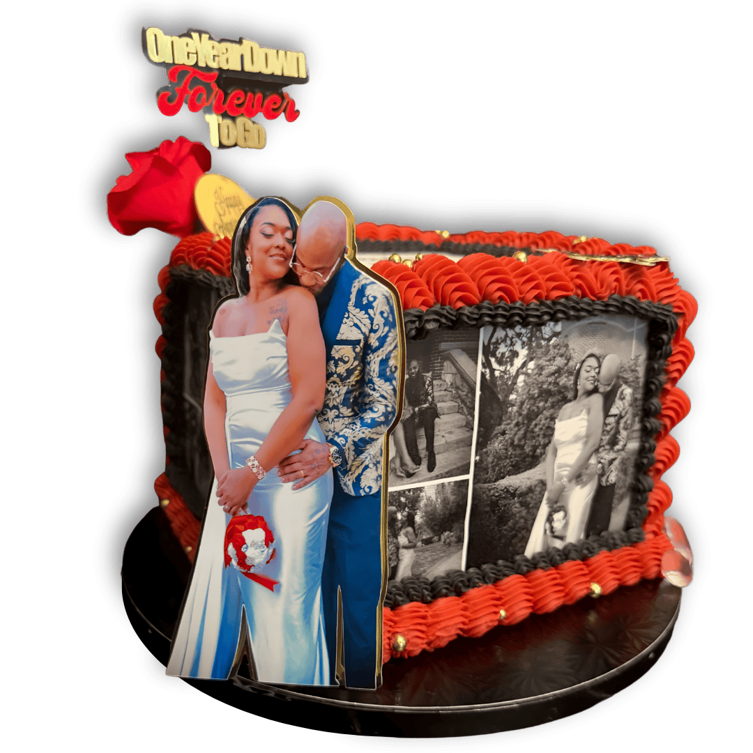 A decorated cake with a photo of an older man and a young woman hugging, along with black and white photos of the same woman on the side. The cake has red and black icing, gold accents, a red rose, and a topper with the words "Oleckahm Forever 106".