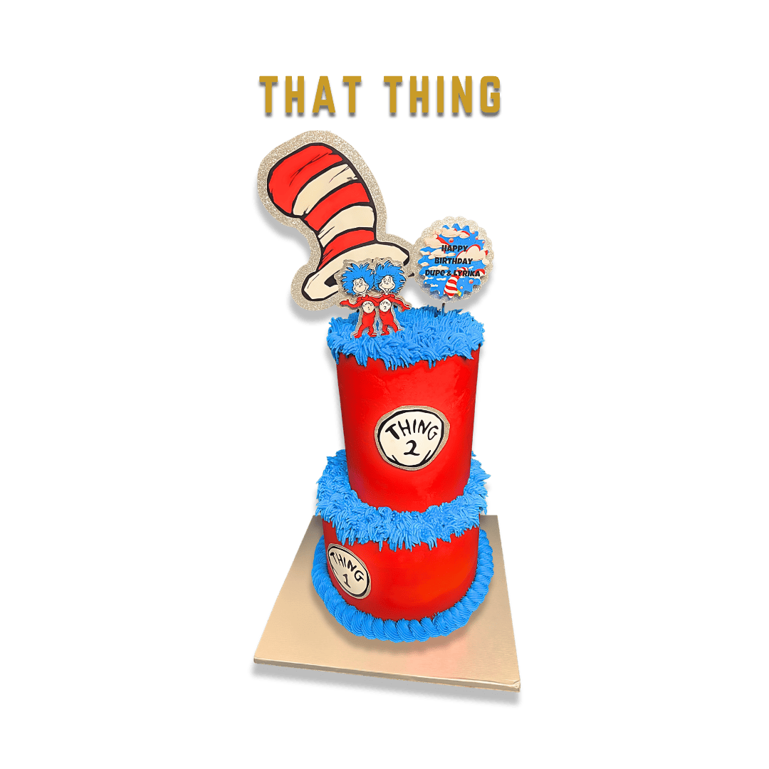 A birthday cake inspired by the Cat in the Hat, featuring a tall red and white striped hat, blue fur-like icing, and Dr. Seuss-themed decorations, including a sign that says "That Thing" and a cake topper with the phrase "Happy Birthday Dr. Seuss".