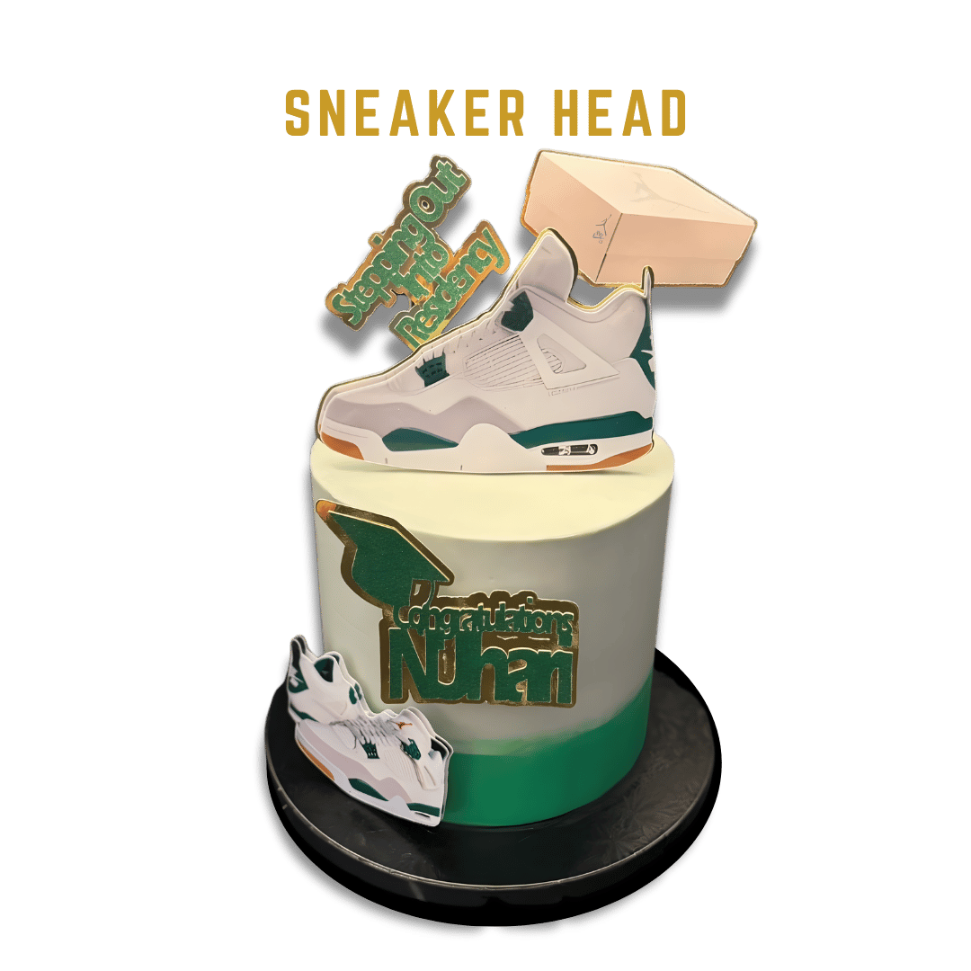 Cake It or Leave It Tampa Designed cake decorated with a Nike sneaker replica, graduation-themed stickers, and congratulatory messages for a graduation celebration.