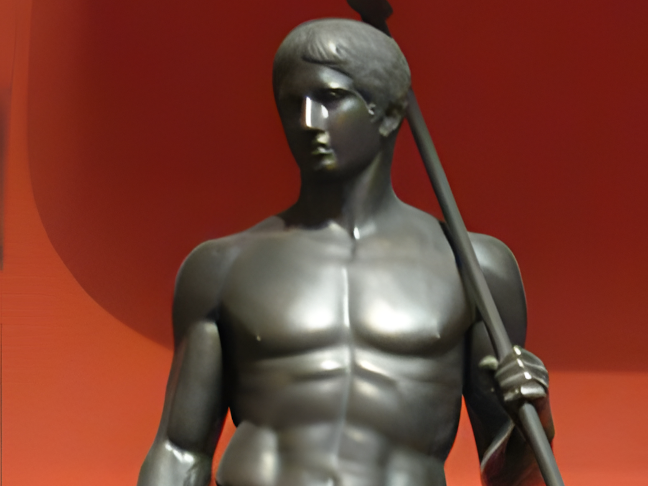 Classical Greek statue of a male figure in contrapposto stance showing balanced proportions and weight shift
