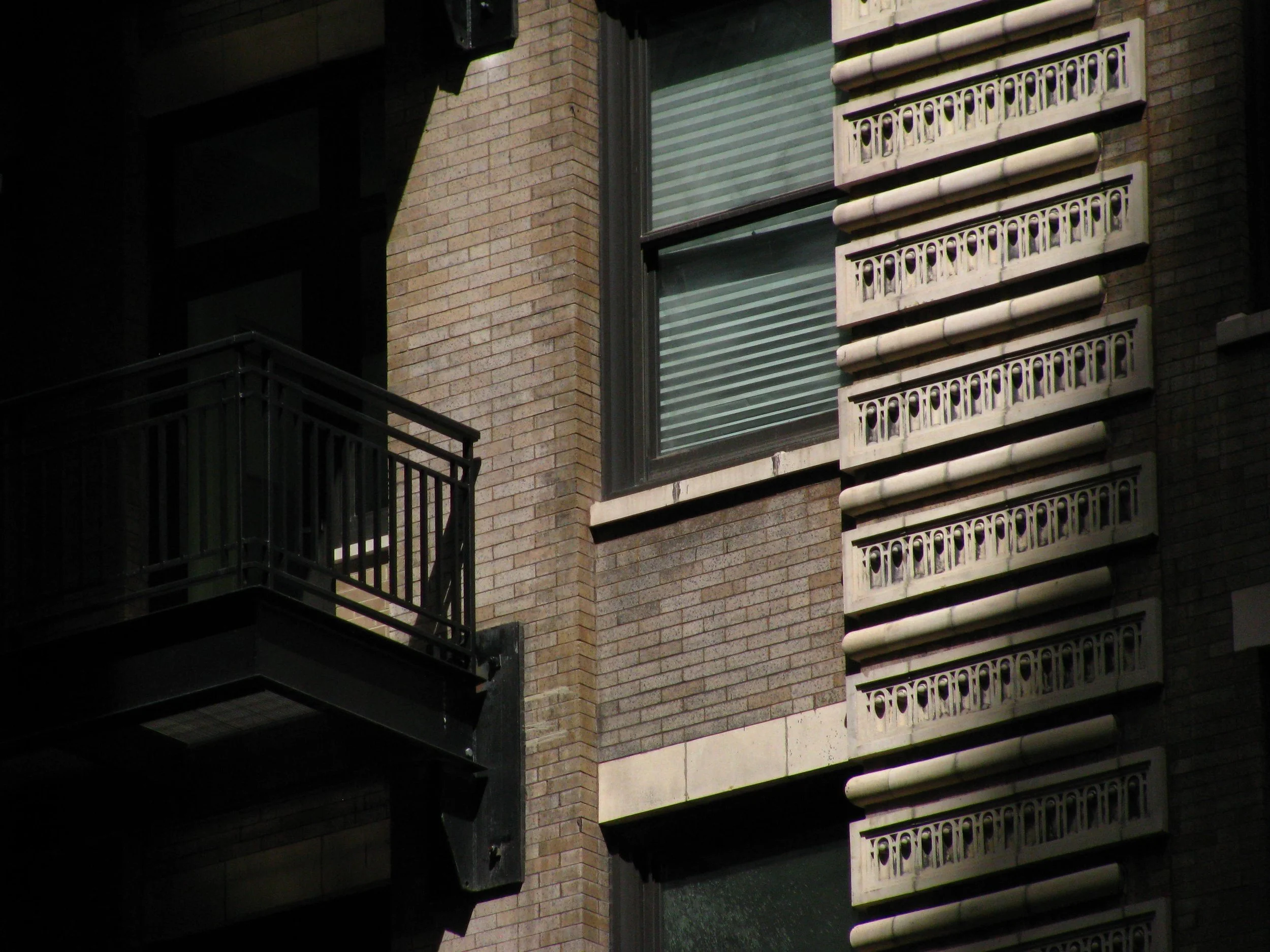 Apartment building illuminated by afternoon sunlight on a Chicago street in 2009.