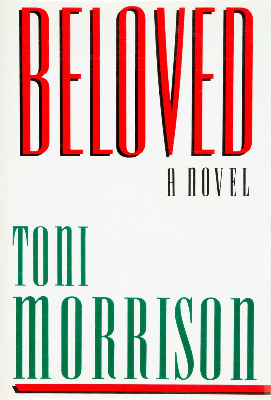 First-edition dust jacket cover of Toni Morrison’s Beloved (1987) with stylized tree silhouette and title typography.