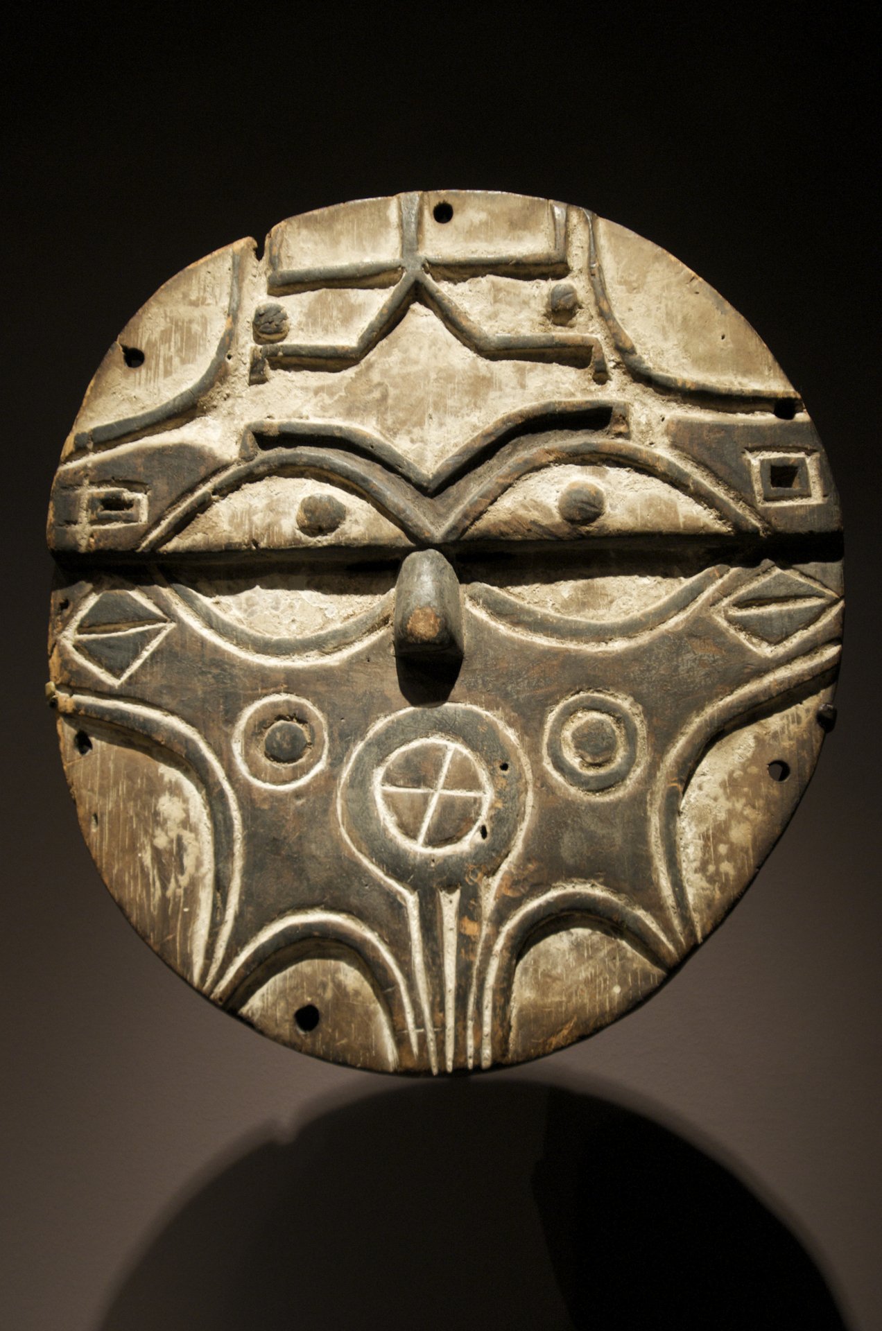West African carved mask photographed from the front, traditionally worn and viewed from multiple angles in performance