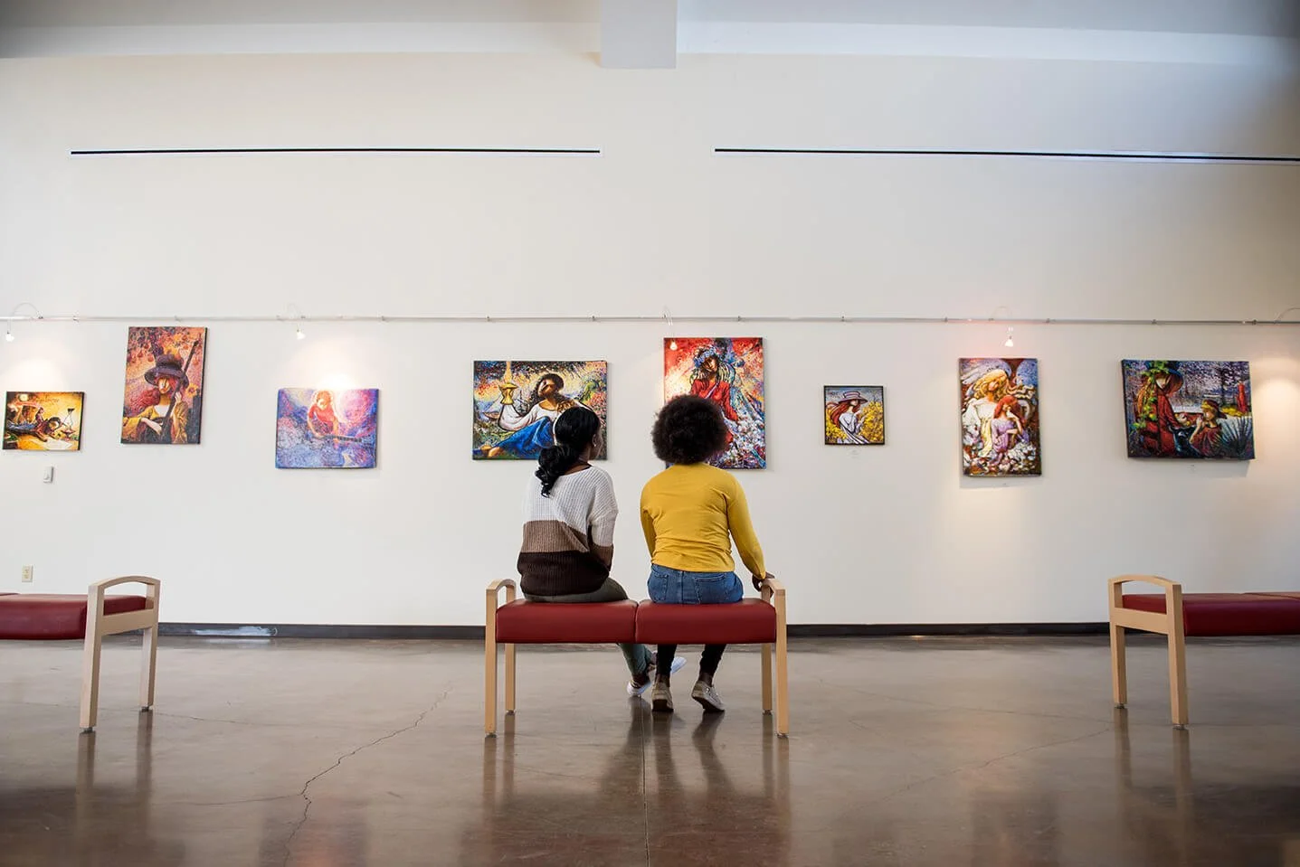 Young girls looking at artwork on the walls at the Northeast Louisiana Delta African-American Heritage Museum.