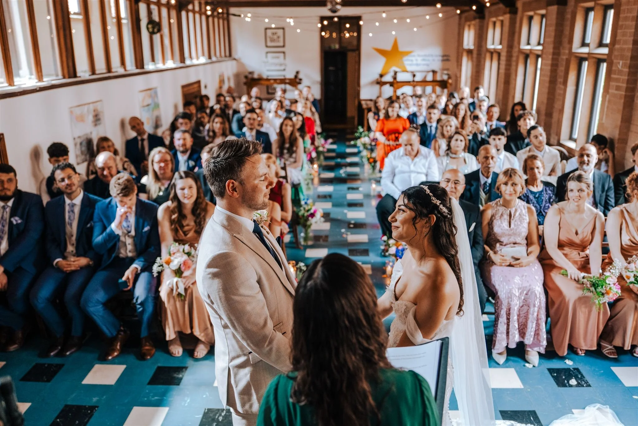 Celebrant ceremony with smiling couple and happy guests.jpg