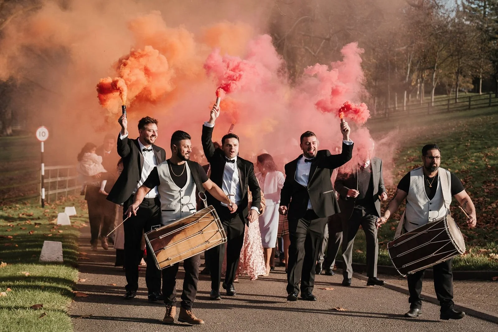 Groom groomsmen and immediate family arrive at hedsor House with Drums and coloured smoke