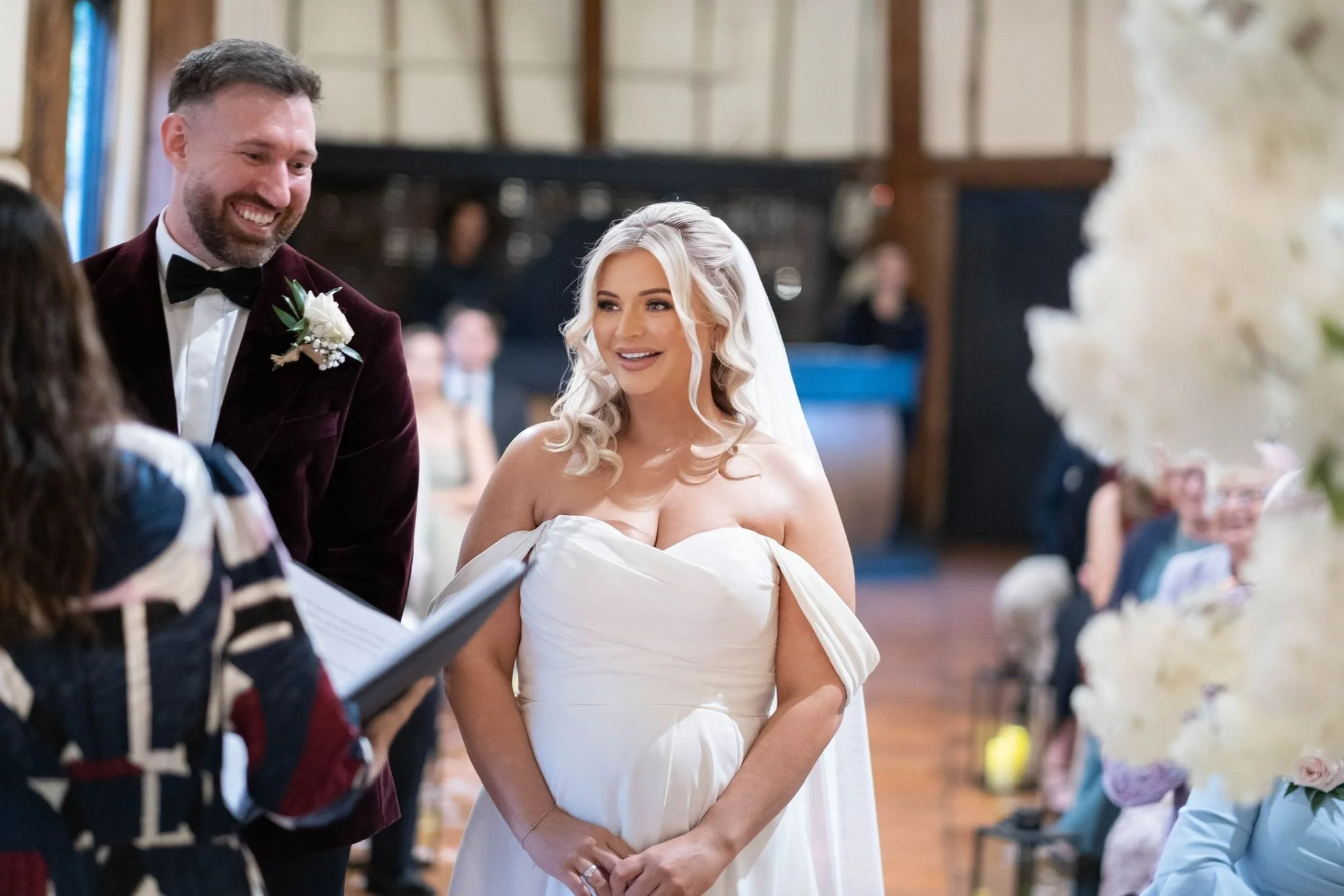 Bride and groom smiling during wedding ceremony.JPG