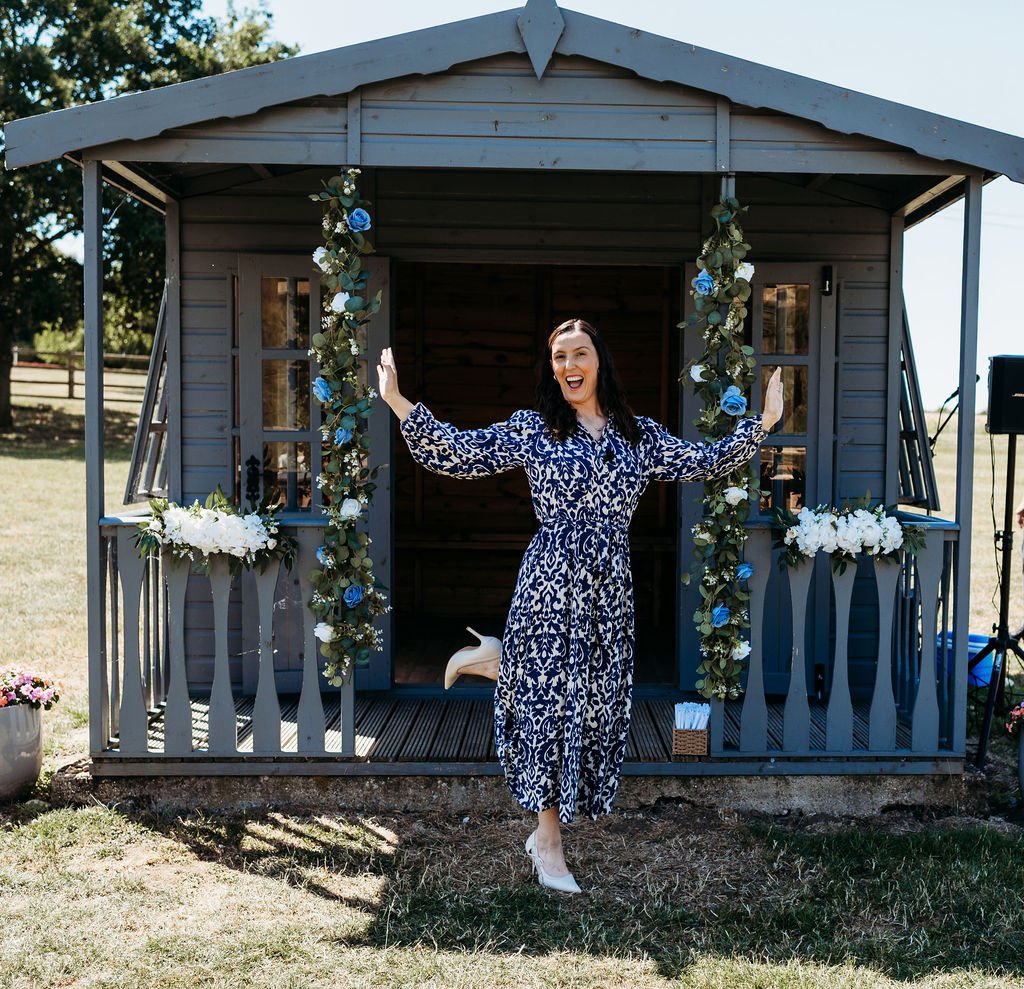 UK wedding celebrant smiling and making fun pose after ceremony.jpg