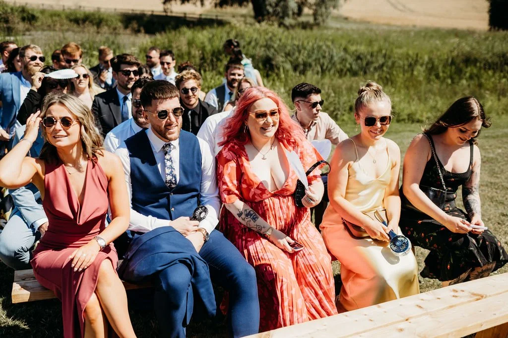 Happy wedding guests smiling