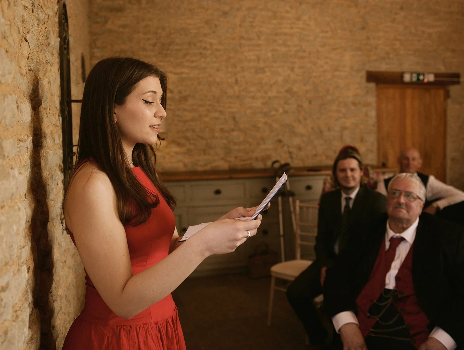 Wedding guest reading in ceremony