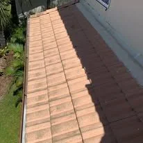 Roof with tan and dark brown tiles