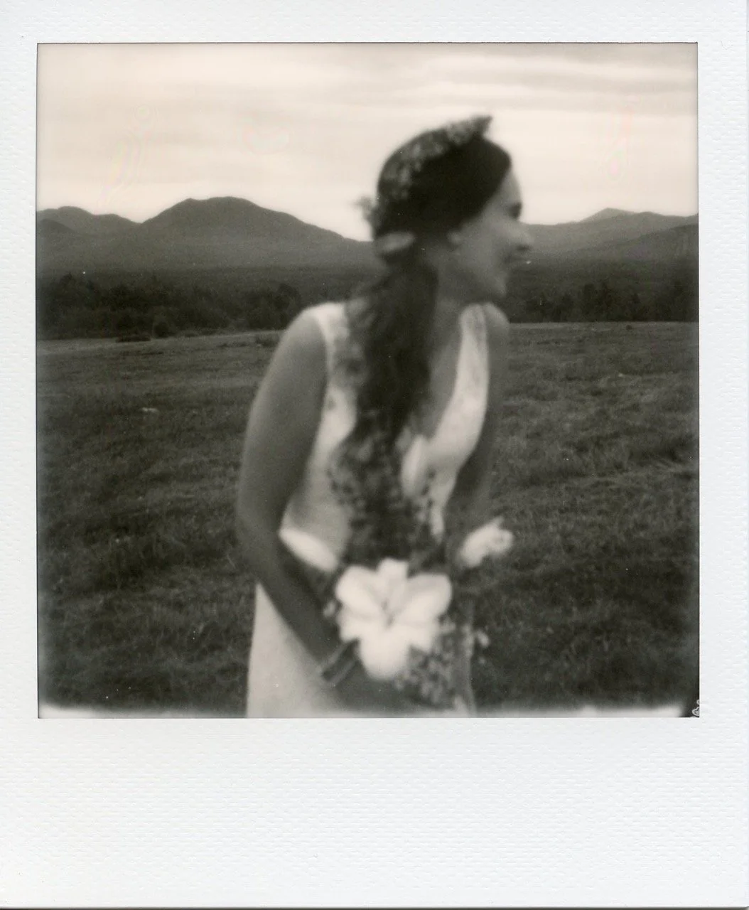 Bride smiling and holding her bouquet
