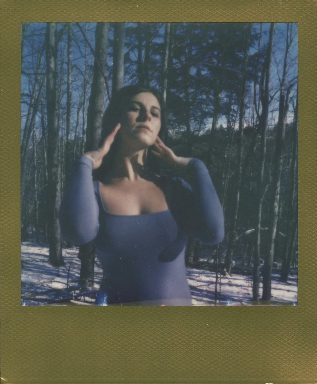 Woman with her eyes closed in nature