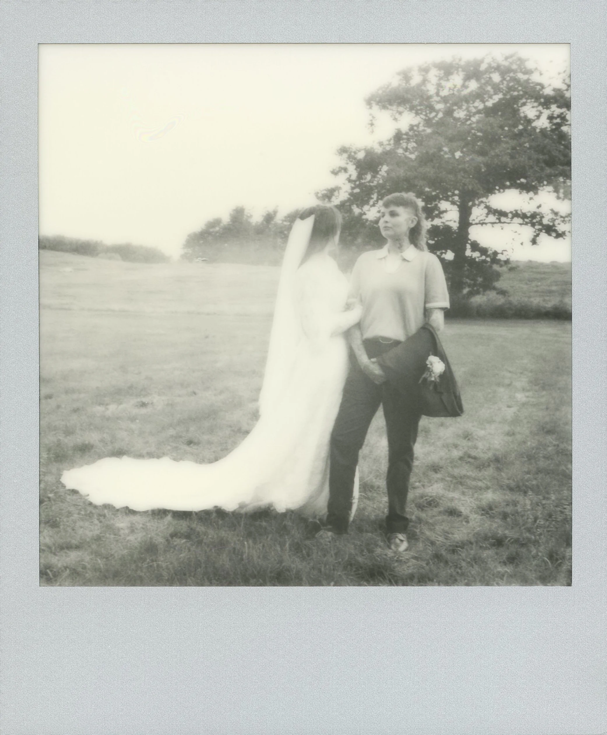 Bride and groom together in a meadow