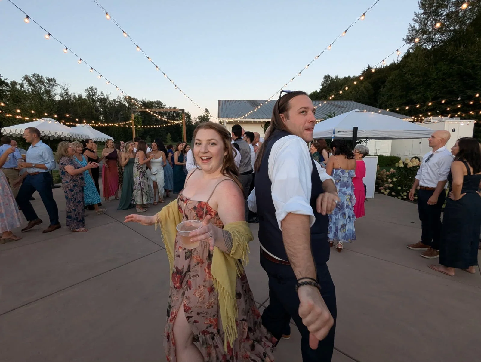 Dancing like big dorks at Patti and Jonathon's wedding, summer 2025