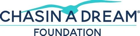 Chasing a Dream Foundation logo with a stylized bird and wave design.
