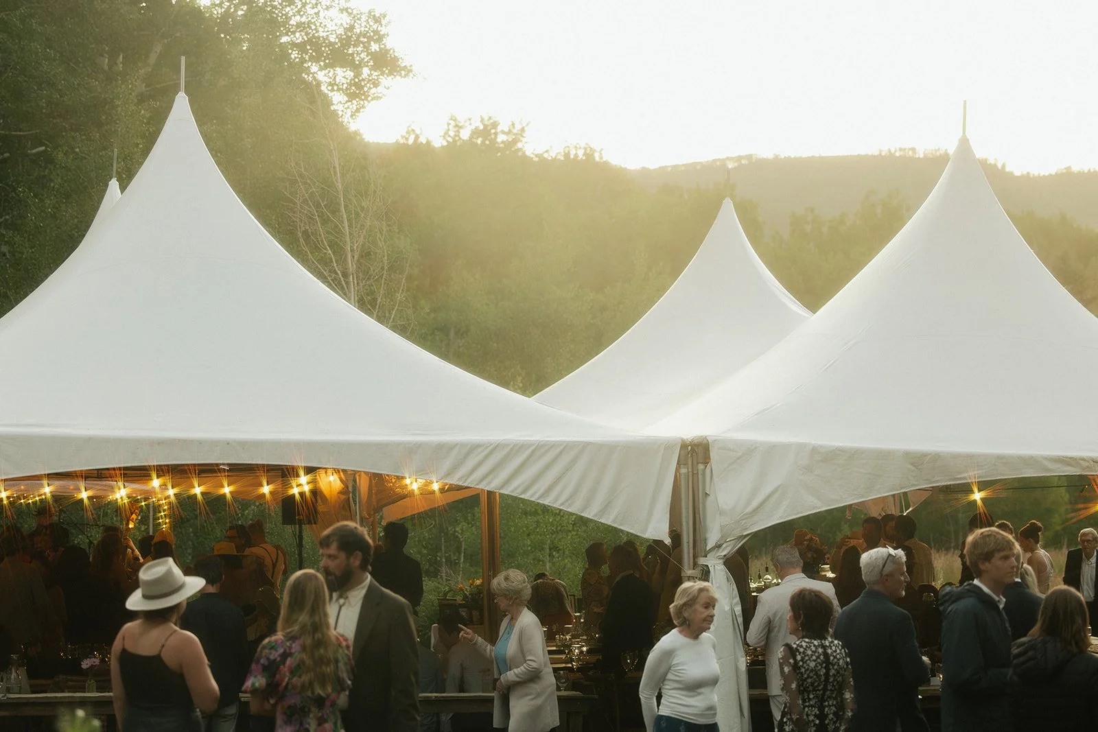 Tent in sunset with bistro twinkle lights