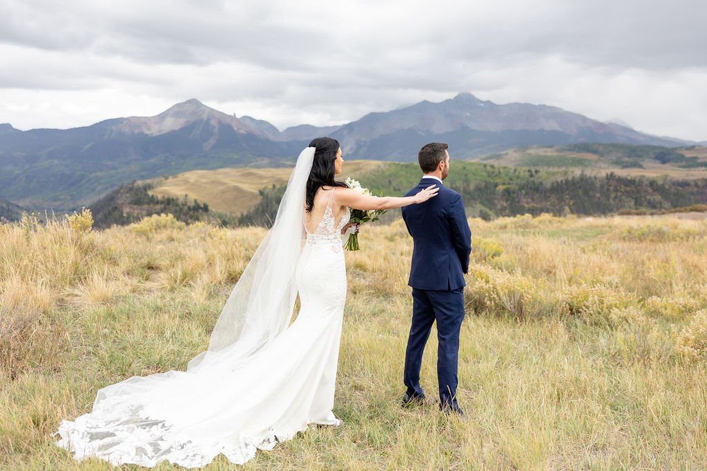 First look photoshoot with a mountain backdrop