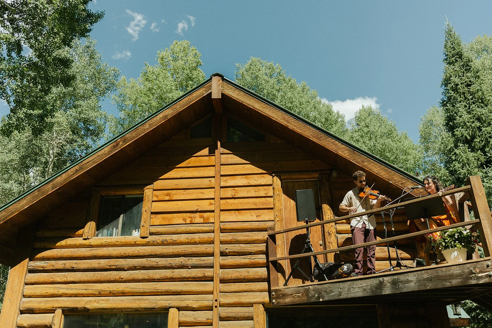 Musicians playing cocktail hour music from porch