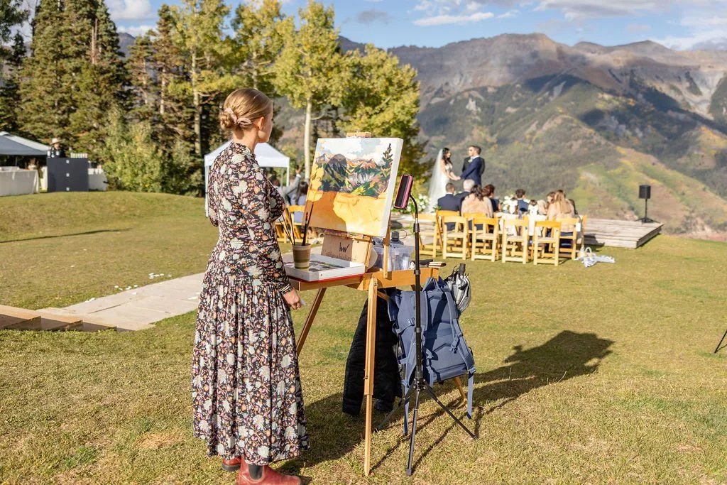 Live painter painting the ceremony at San Sophia Overlook in Telluride, Colorado