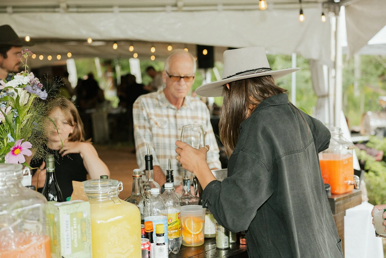Bartender serving in tent