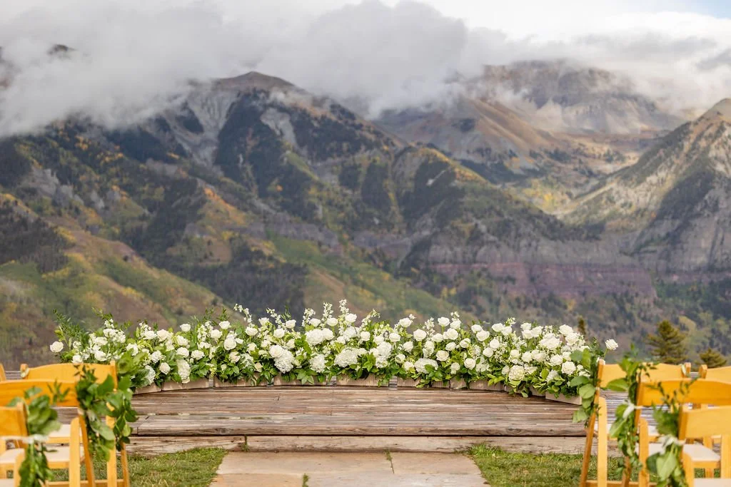 San Sophia Overlook set up for ceremony with white flowers and greens