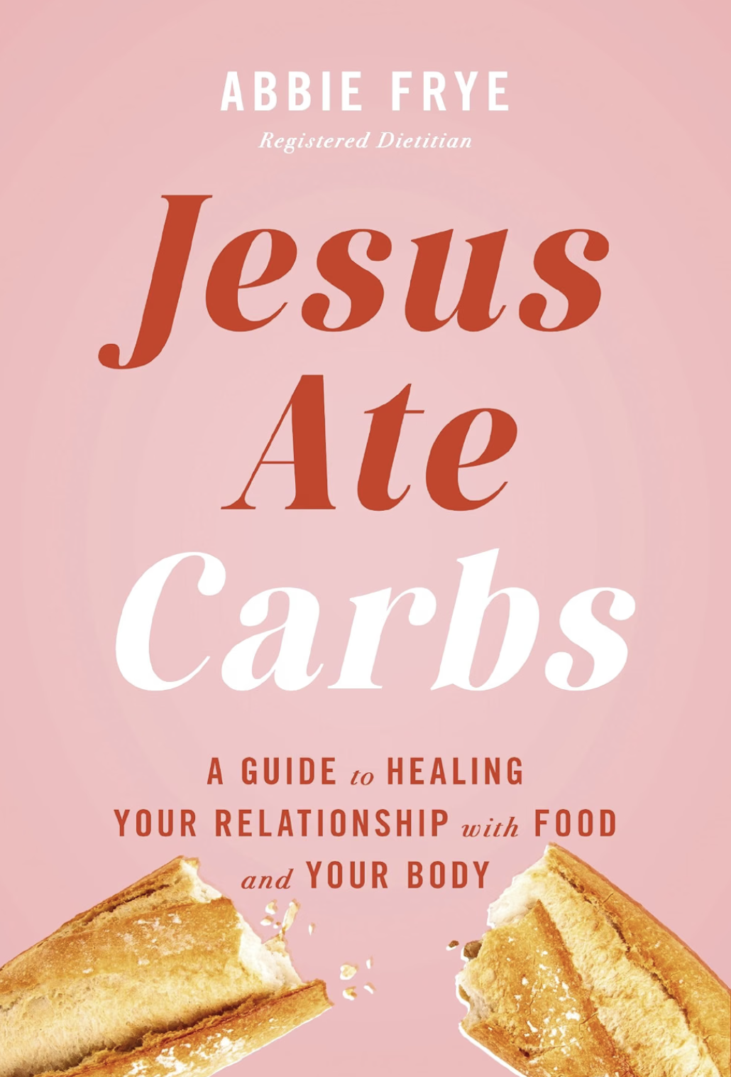 Book cover titled "Jesus Ate Carbs" by Abbie Frye, with a pink background and images of a broken sandwich or toast at the bottom.
