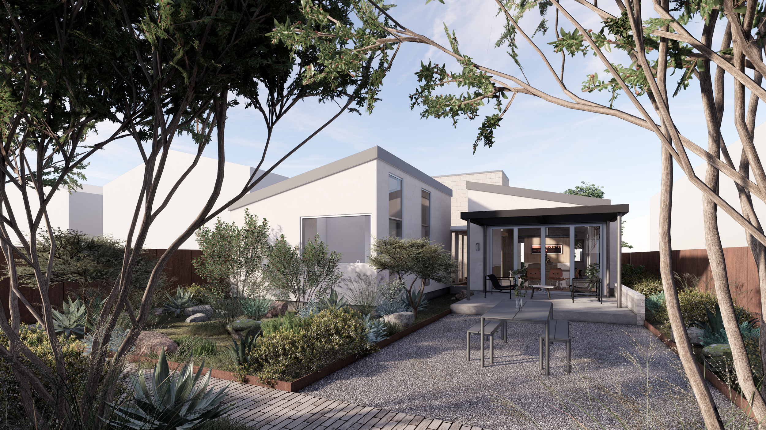 A modern backyard with a small covered patio, outdoor seating, a gravel ground, and a desert-style landscape with rocks, shrubs, and trees, surrounded by white contemporary houses.