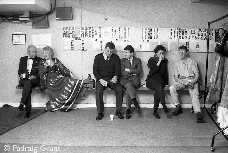 'Green Room' Theatre Royal, Wexford Festival Opera 1991
At left Cyril Nolan chats to WFO Chair Barbara Wallace, next is fire officer Bernard Gavin, orchestra porter Liam Kienan and at far right stagehand Paulo Foley chats to stage manager Chantal Ha