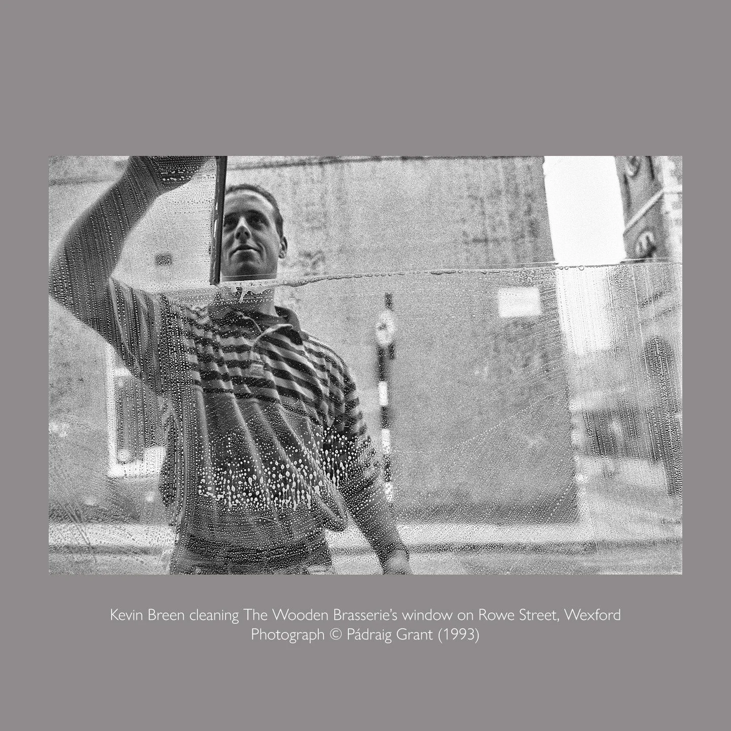 Kevin Breen cleaning The Wooden Brasserie's window on Rowe Street, Wexford 1993

Photograph &copy; P&aacute;draig Grant

#padraiggrantswexford #filmphotography #blackandwhitephotography #streetphotography