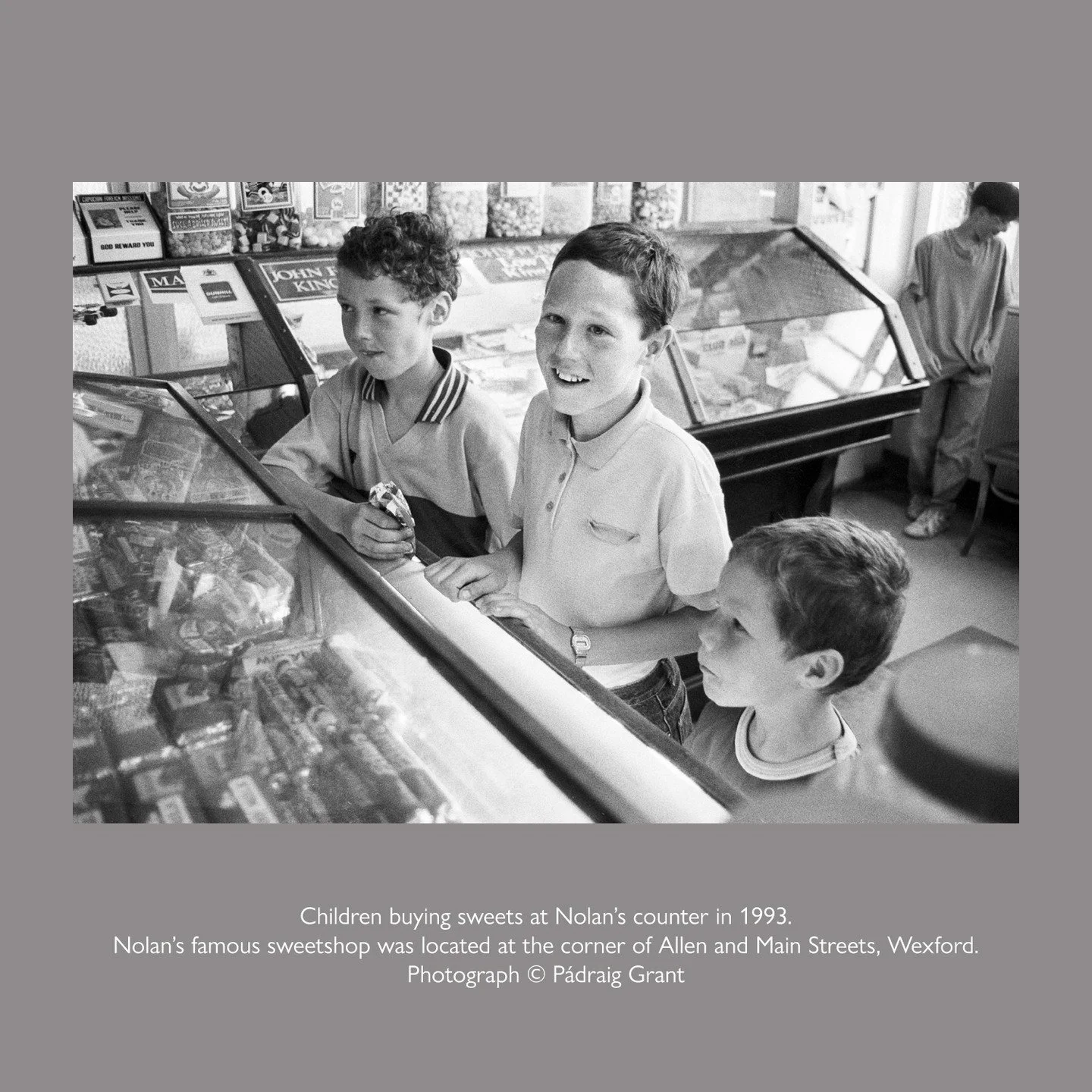 Children buying sweets at Nolan&rsquo;s counter in 1993. Nolan&rsquo;s famous sweetshop was located at the corner of Allen and Main Streets, Wexford.

Photograph &copy; P&aacute;draig Grant
#padraiggrantswexford