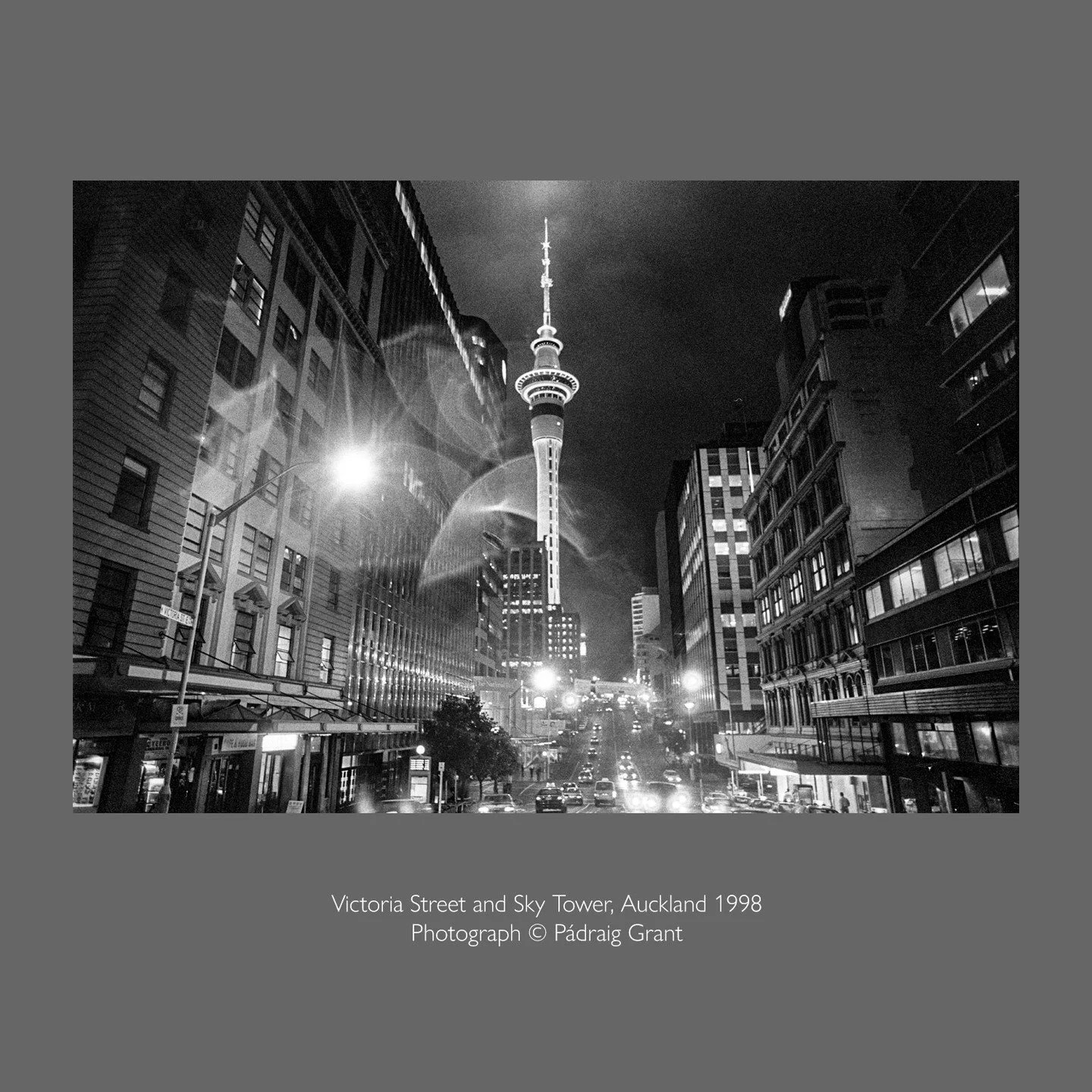 A rainy night in downtown Auckland looking along Victoria Street to the recently completed Sky Tower. 
Completed in August 1997 it is still the Tallest Freestanding Structure (Tower) in the southern hemisphere at 328 metres high.

Photograph &copy; P