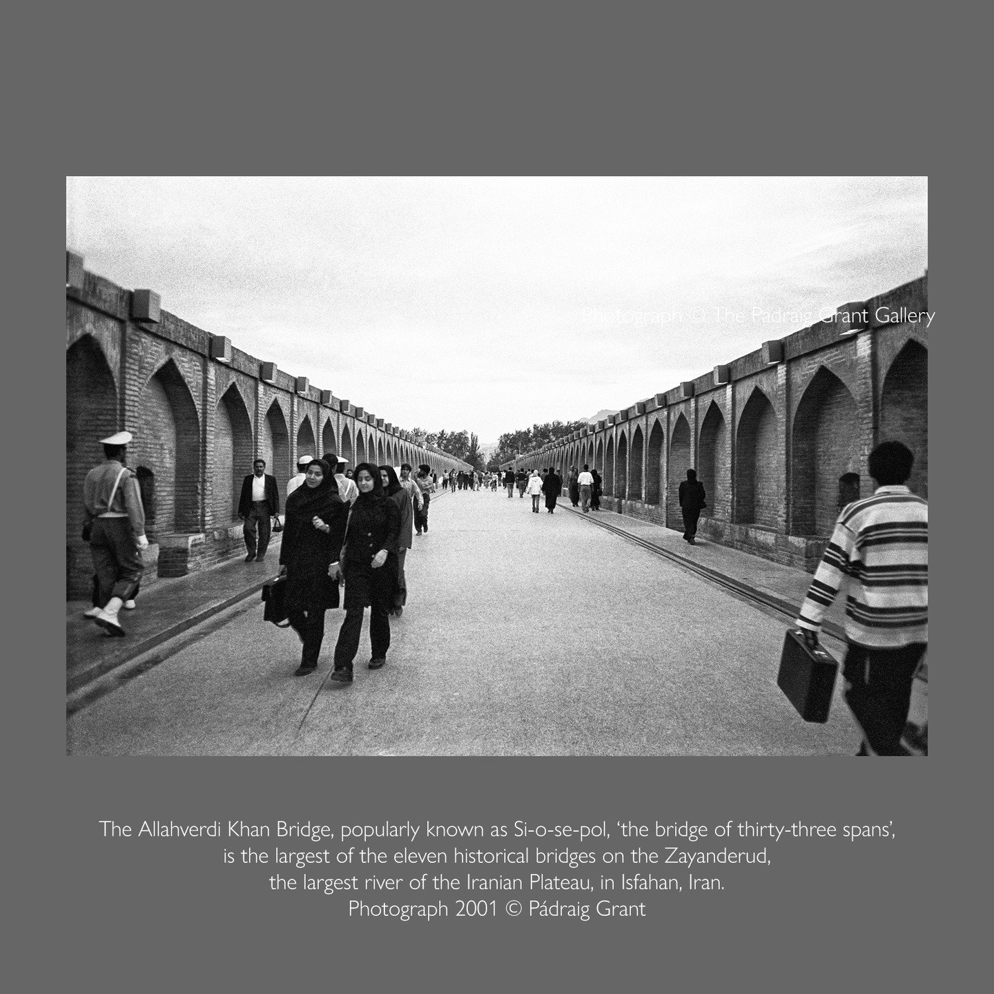 Returning home at dusk the citizens of Isfahan, Iran walk across the majestic 17th century "bridge of 33 spans" in 2001. 

Do not share without credit or tag:
Photograph &copy; P&aacute;draig Grant

#padraiggrantsworld #photojournalism #fil