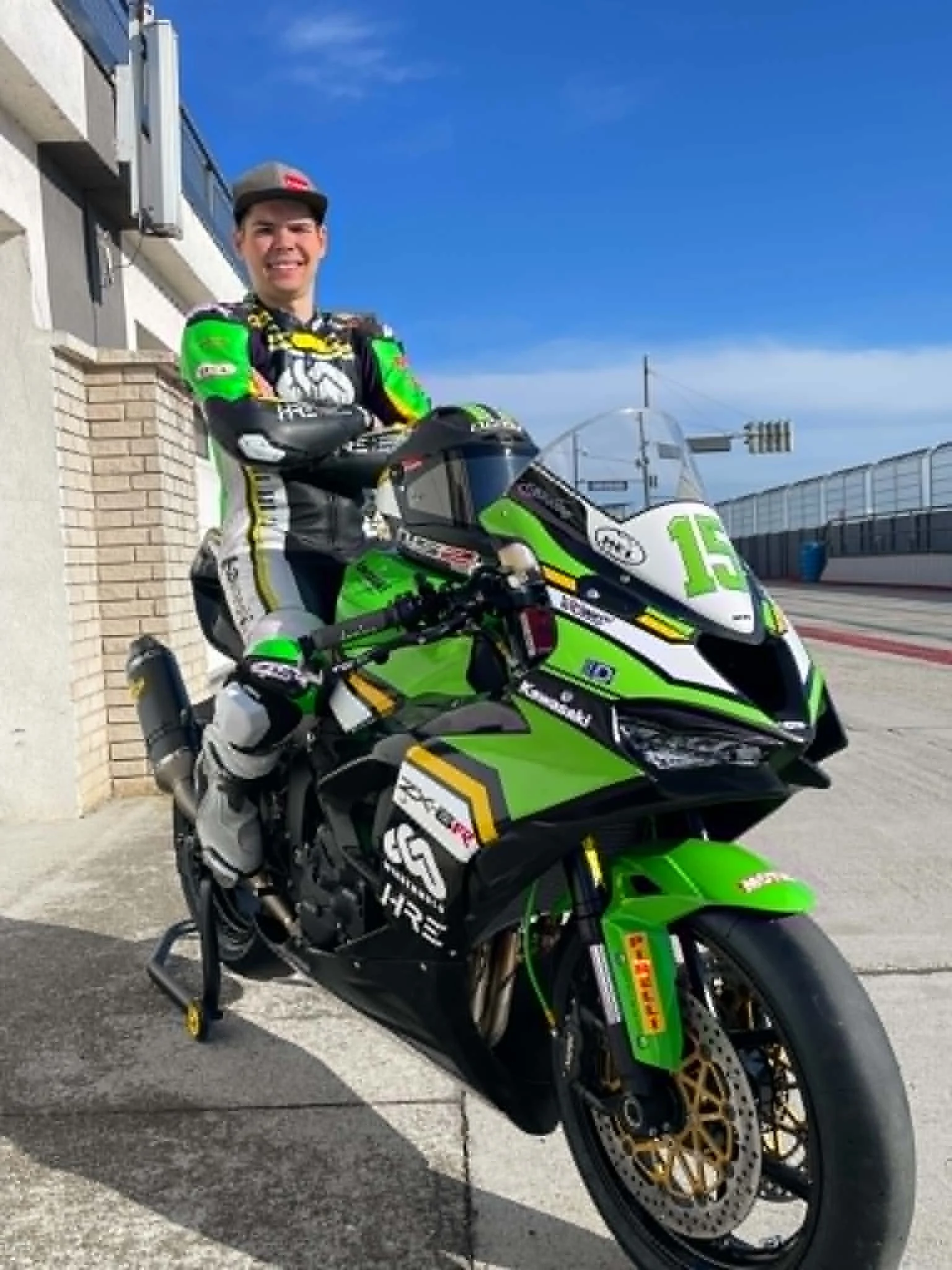 Luki Owen smiling on the number 15 Minden Moto Kawasaki race bike