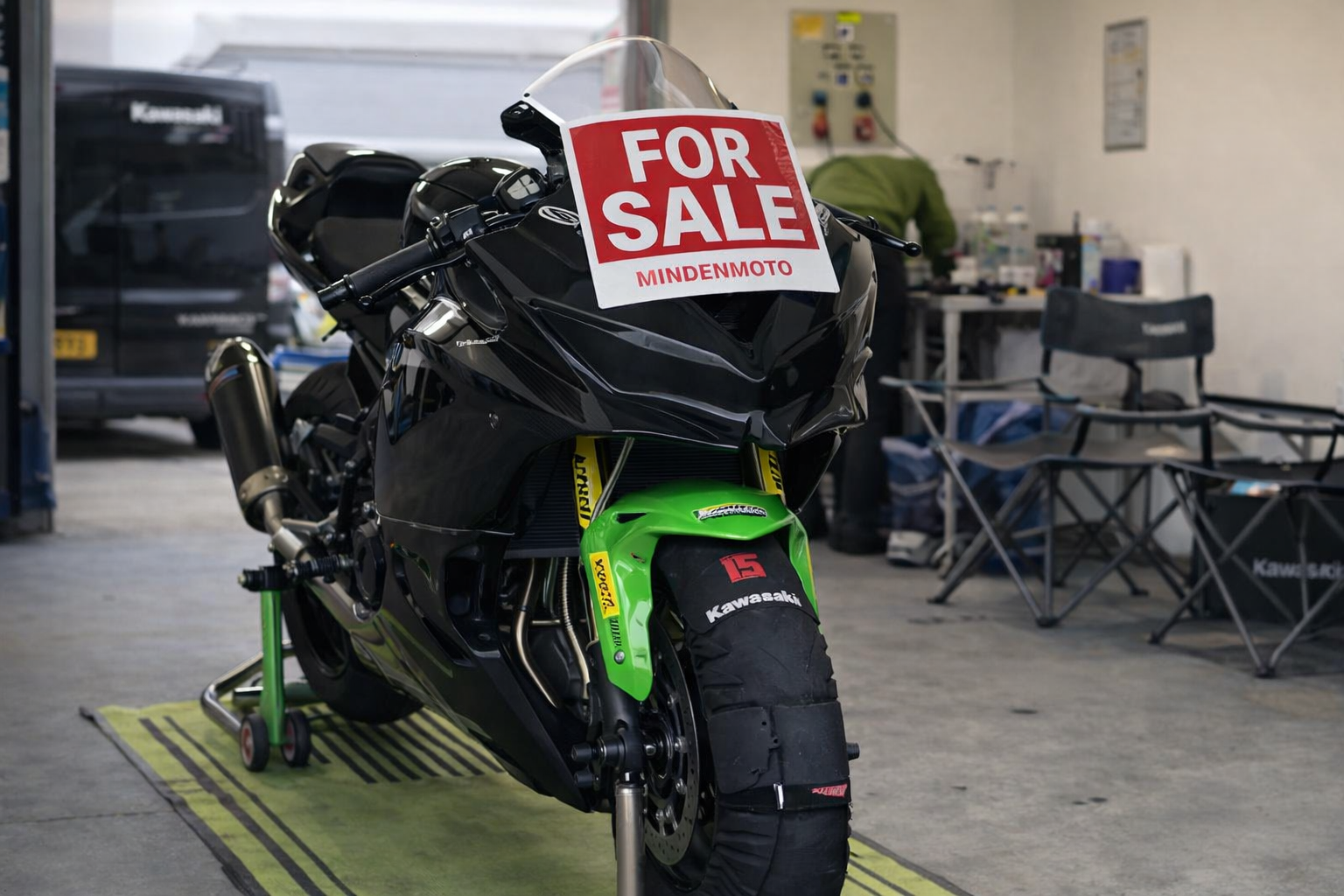 black kawasaki zx4rr race bike with for sale sign