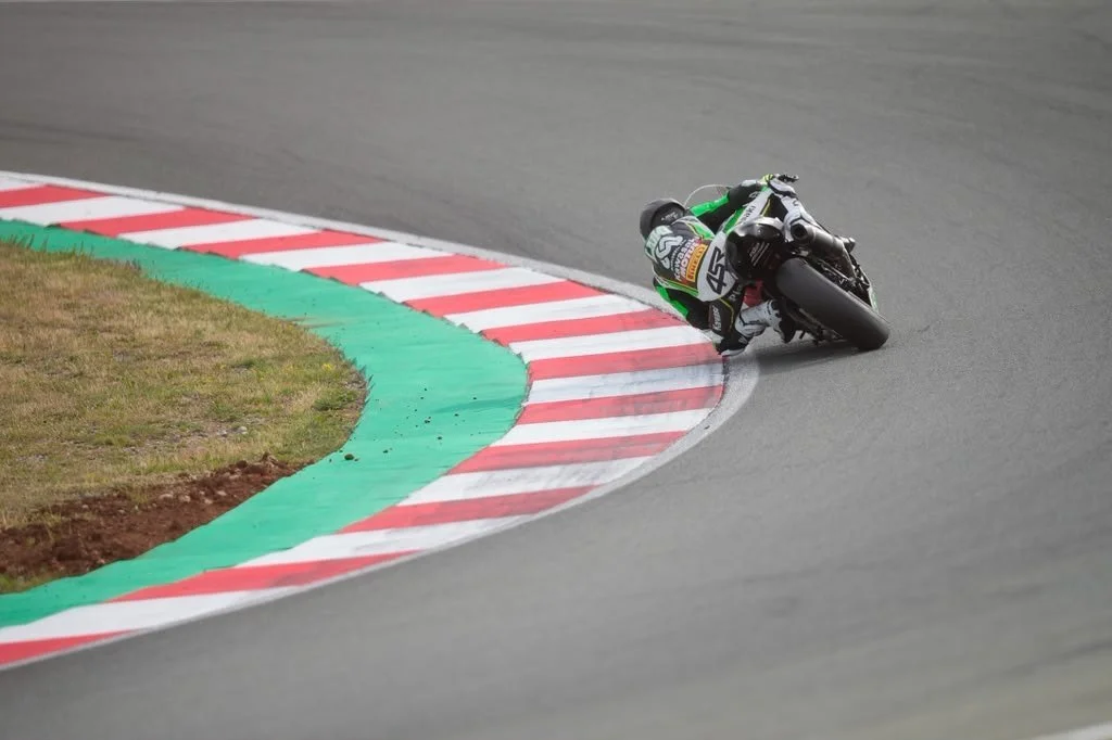 Rear view of Luki Owen on the ZX-6R Sportbike through a circuit corner — 2026 season