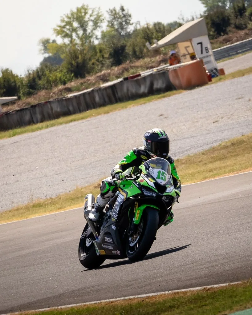 Luki Owen accelerating on the Kawasaki ZX-6R Sportbike beside the circuit — 2026 season