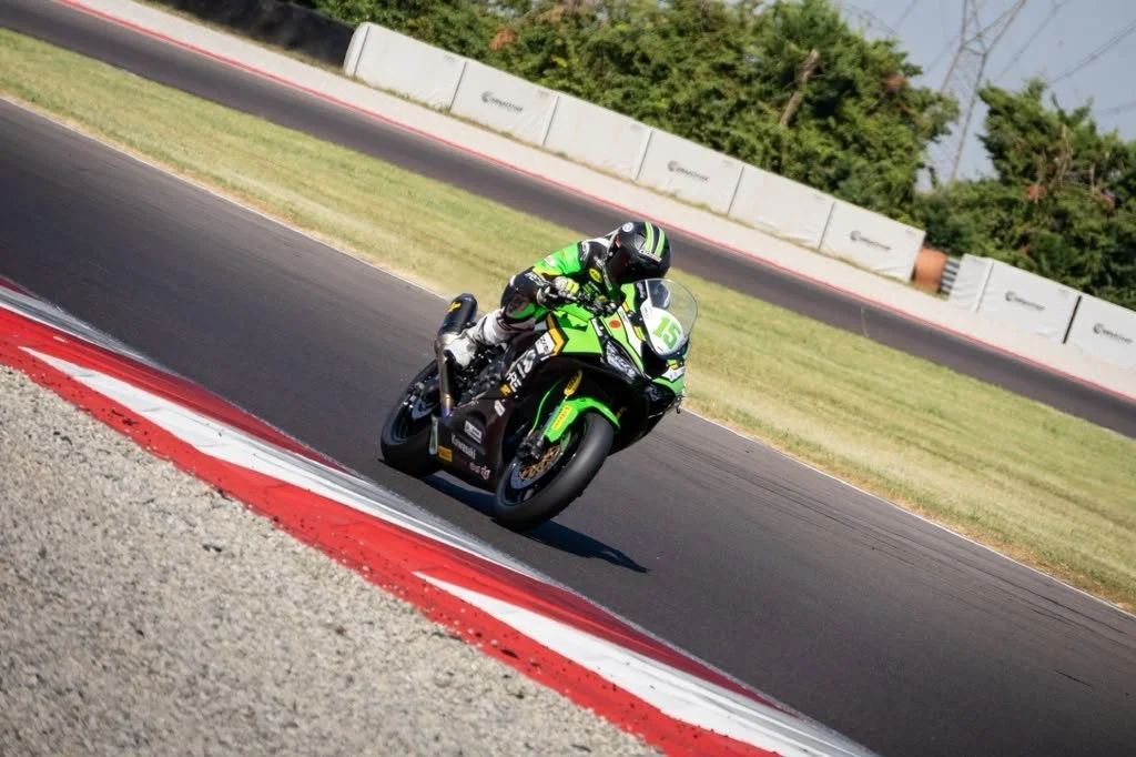 Luki Owen on the Kawasaki ZX-6R Sportbike beside a red and white kerb — 2026 season