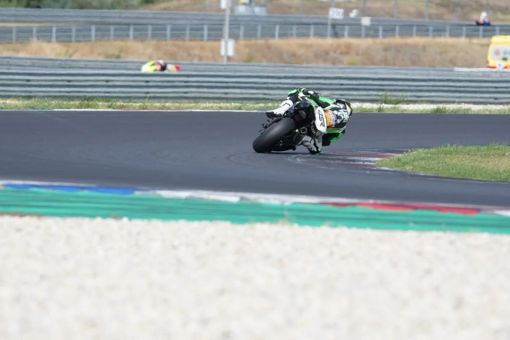 Luki Owen cornering on the Kawasaki ZX-6R Sportbike in front of the grandstands — 2026 season