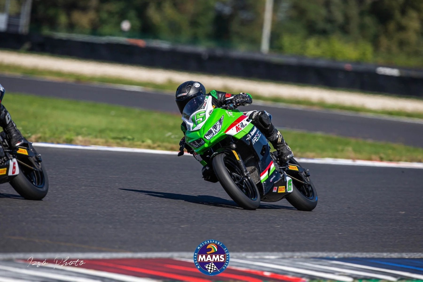 Luki cornering on the number 15 Kawasaki — AAIMC Slovakia Ring final round, SSP300