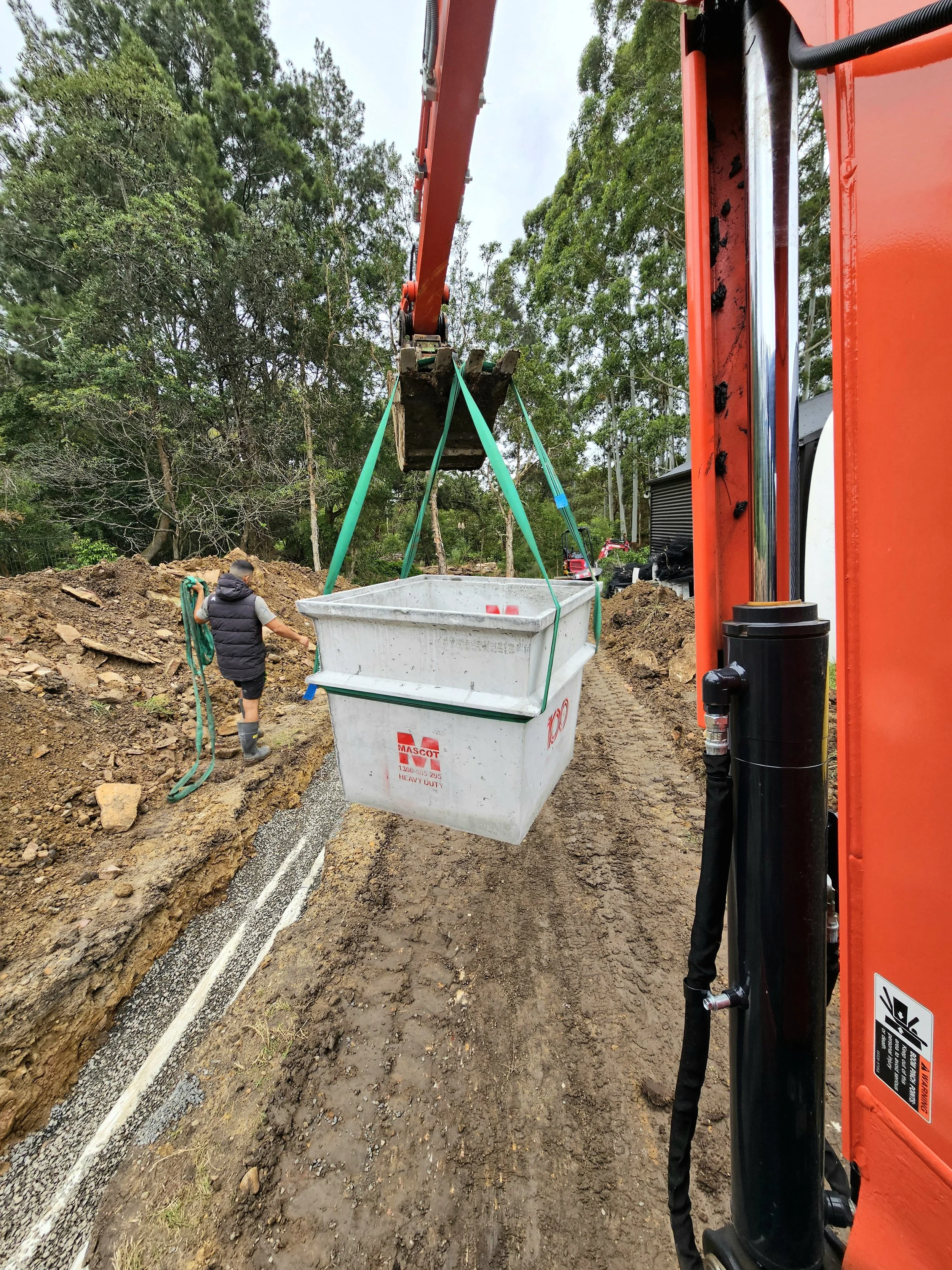 pit installation for a plumbing project using an excavator in Sydney
