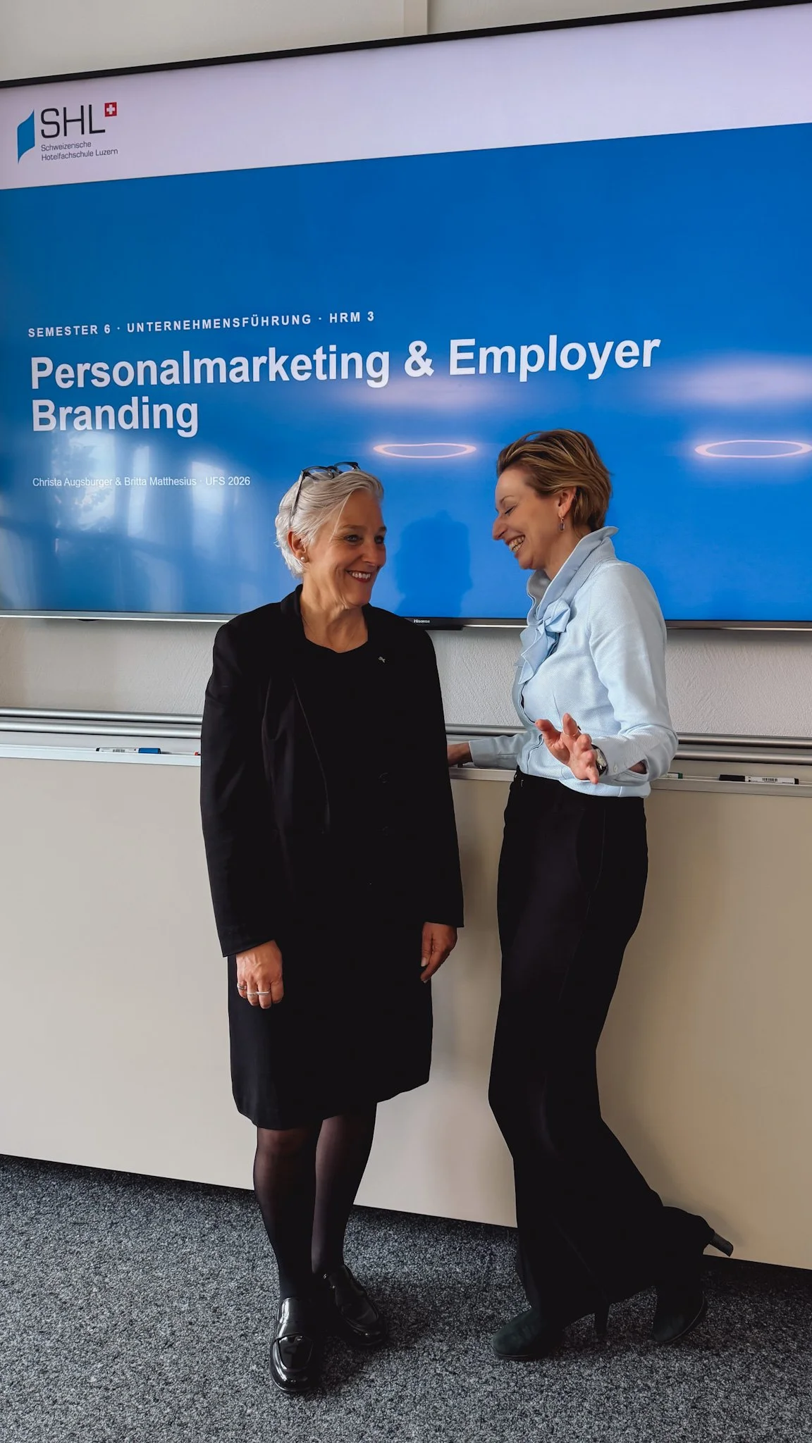 ritta Matthesius (NOUWORK) and Director Christa Augsburger in front of their joint presentation at SHL Schweizerische Hotelfachschule Luzern.