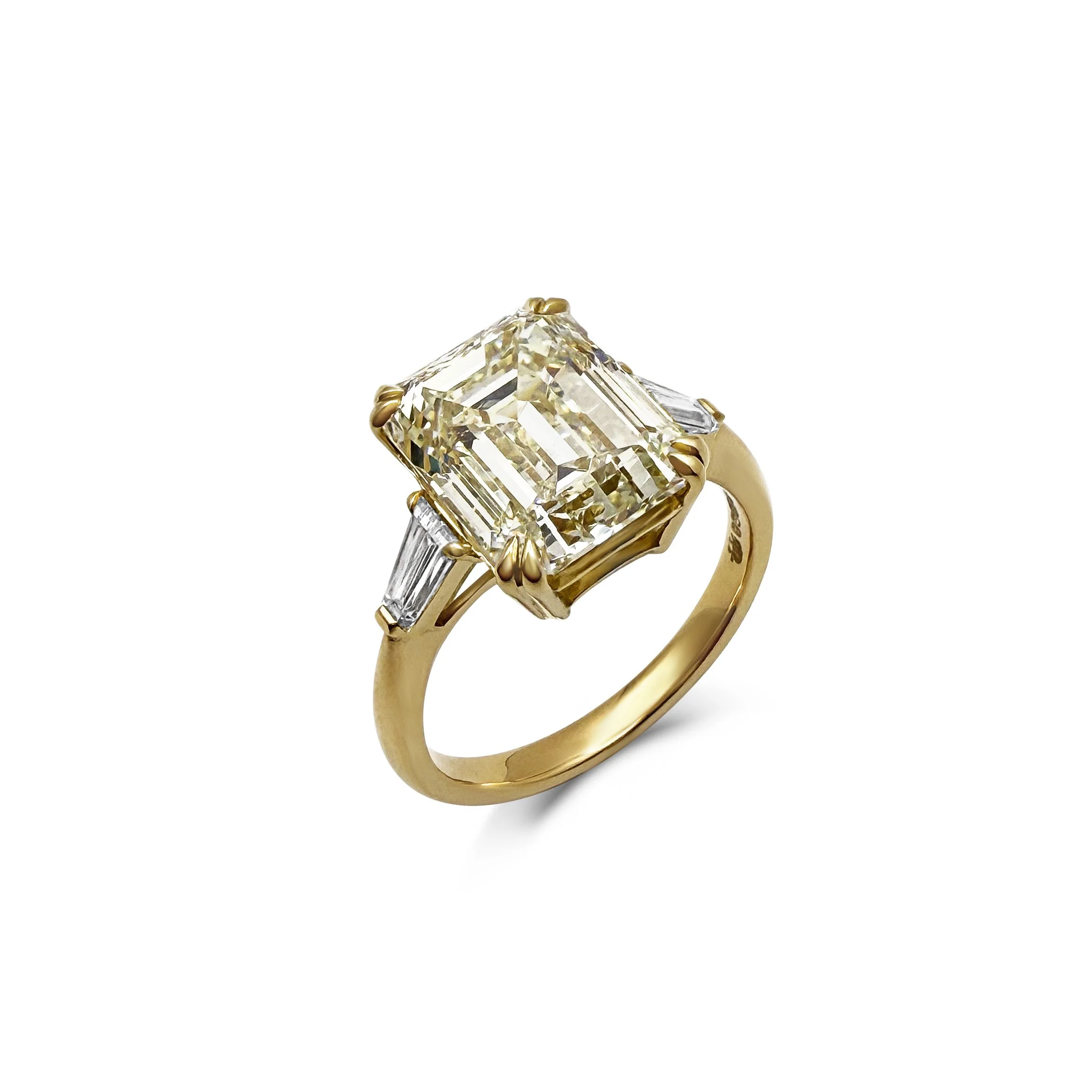 Fancy yellow diamond three-stone ring
