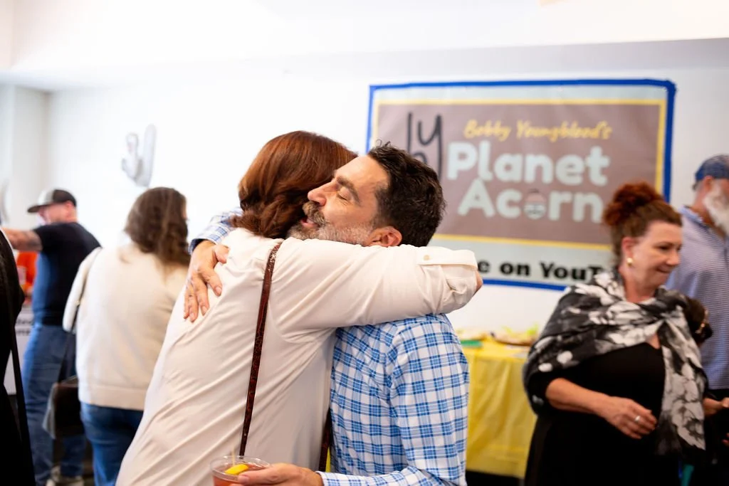 hugging margaret ribbon cutting.jpg