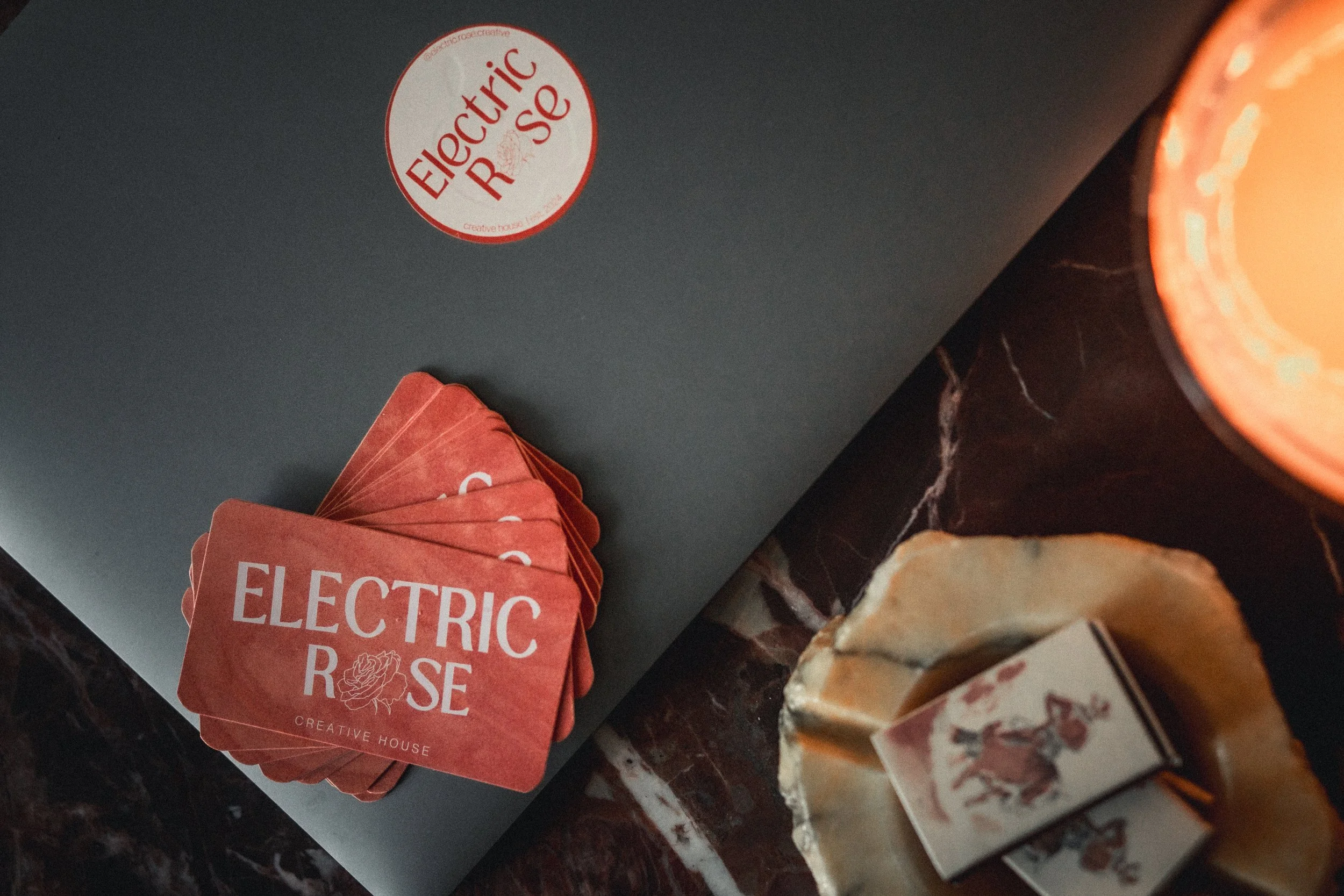 Electric Rose laptop flatlay with business cards - based in Nashville, TN