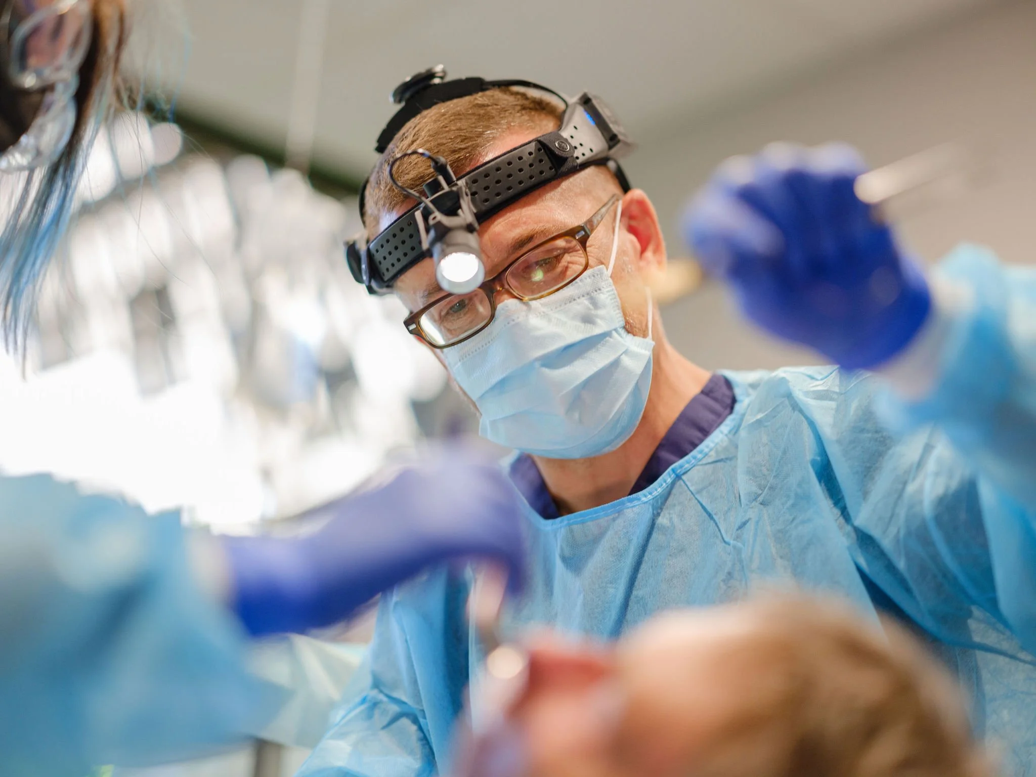 Doctor performing oral surgery