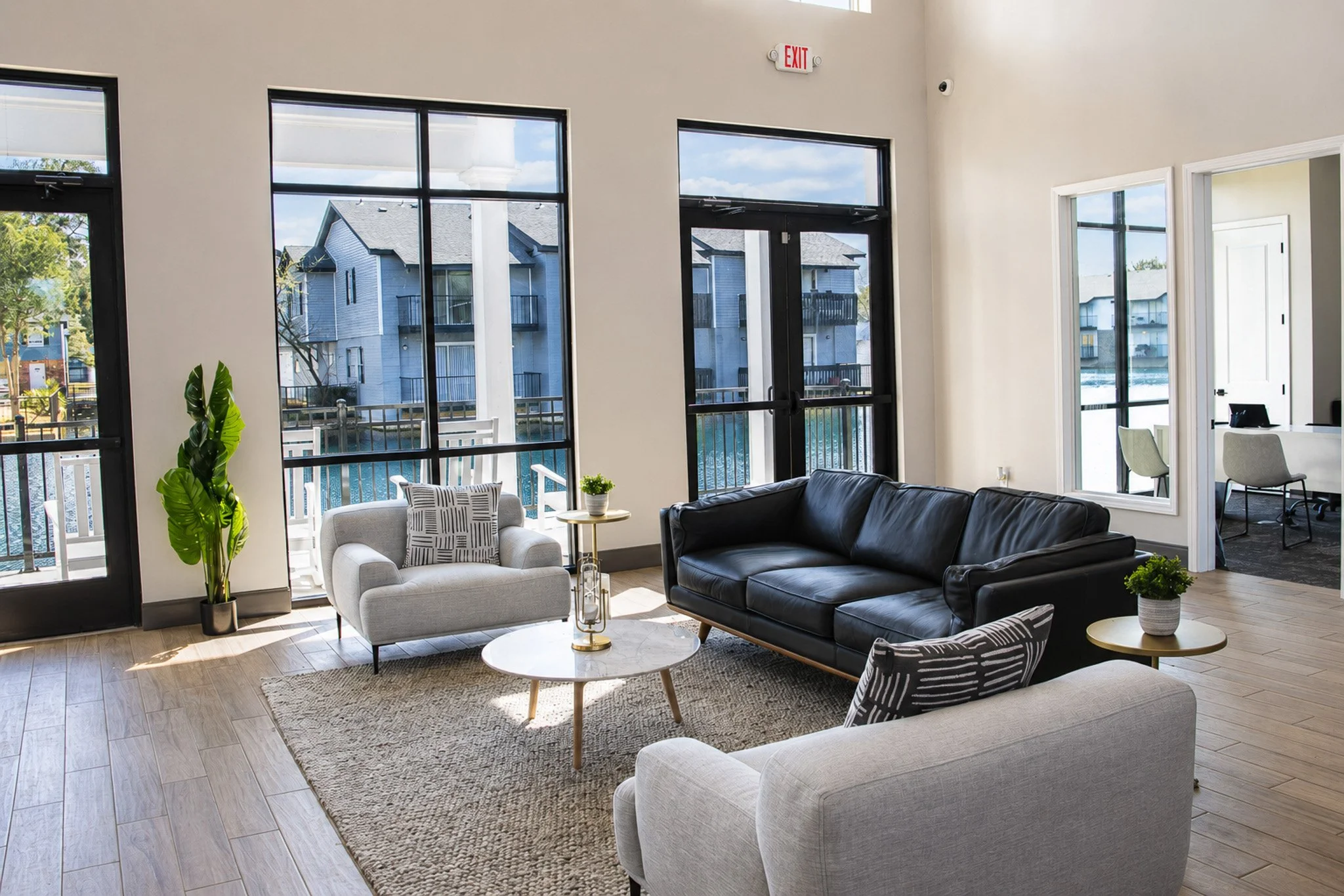 Interior view of the clubhouse with cozy seating and accent plants.