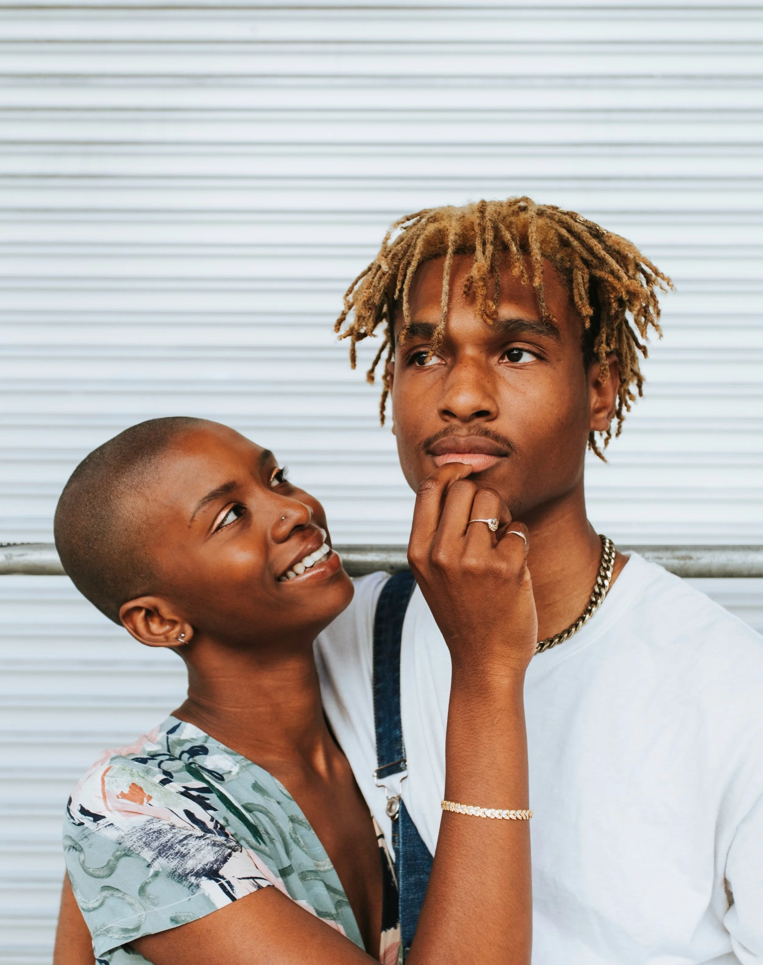 african-american-couple-posing-by-wall.jpg
