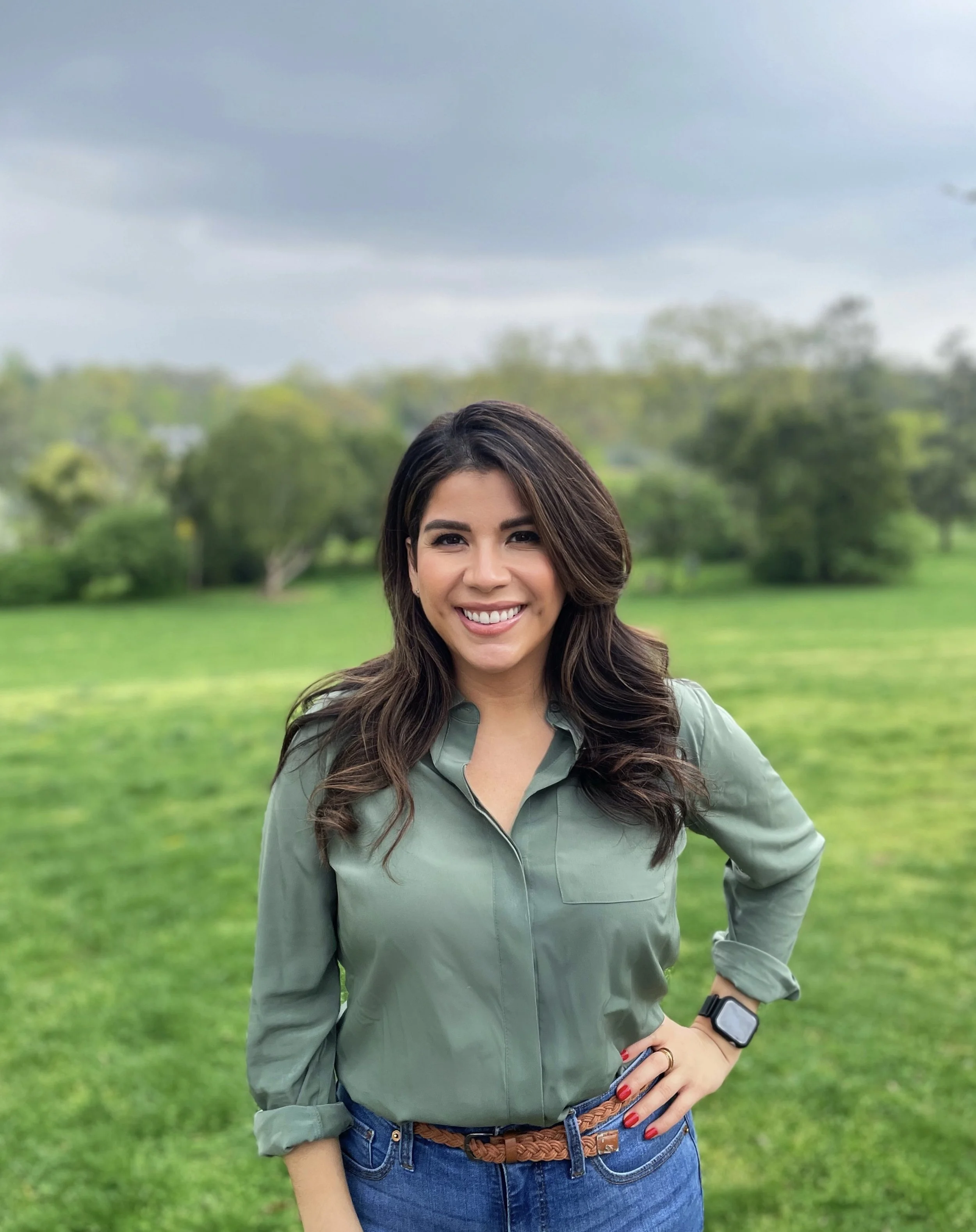 Portrait of therapist Alessandra Avallone outdoors in a green blouse